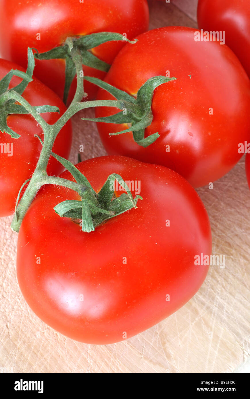 Tomatoes on the cutting board Stock Photo - Alamy