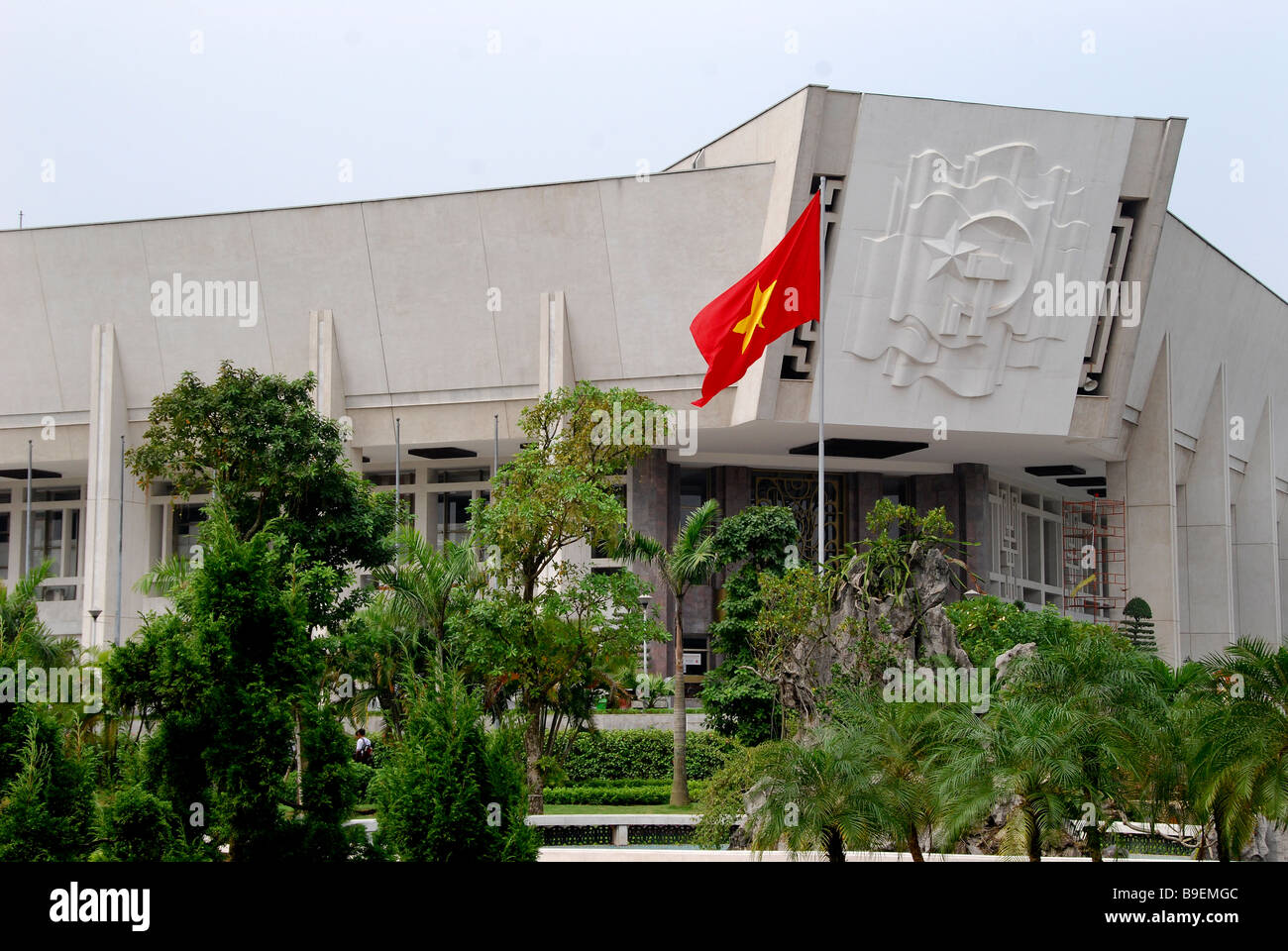 Hi Chi Minh Museum with Vietnam flag flying Stock Photo