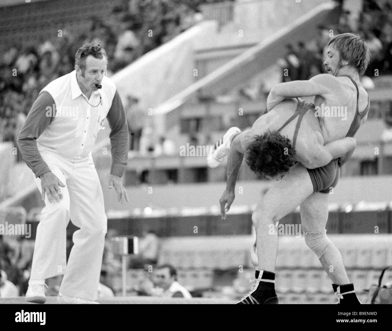 Wrestler Valdimir Tikhonov holds Lakhkard Ali during Greco Roman ...