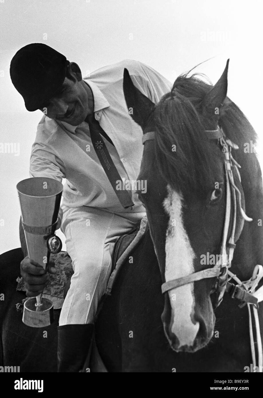 Maksud Kurbanov 11 Times Horse Racing Champion Showing A Prize His Horse Was Awarded Stock Photo Alamy