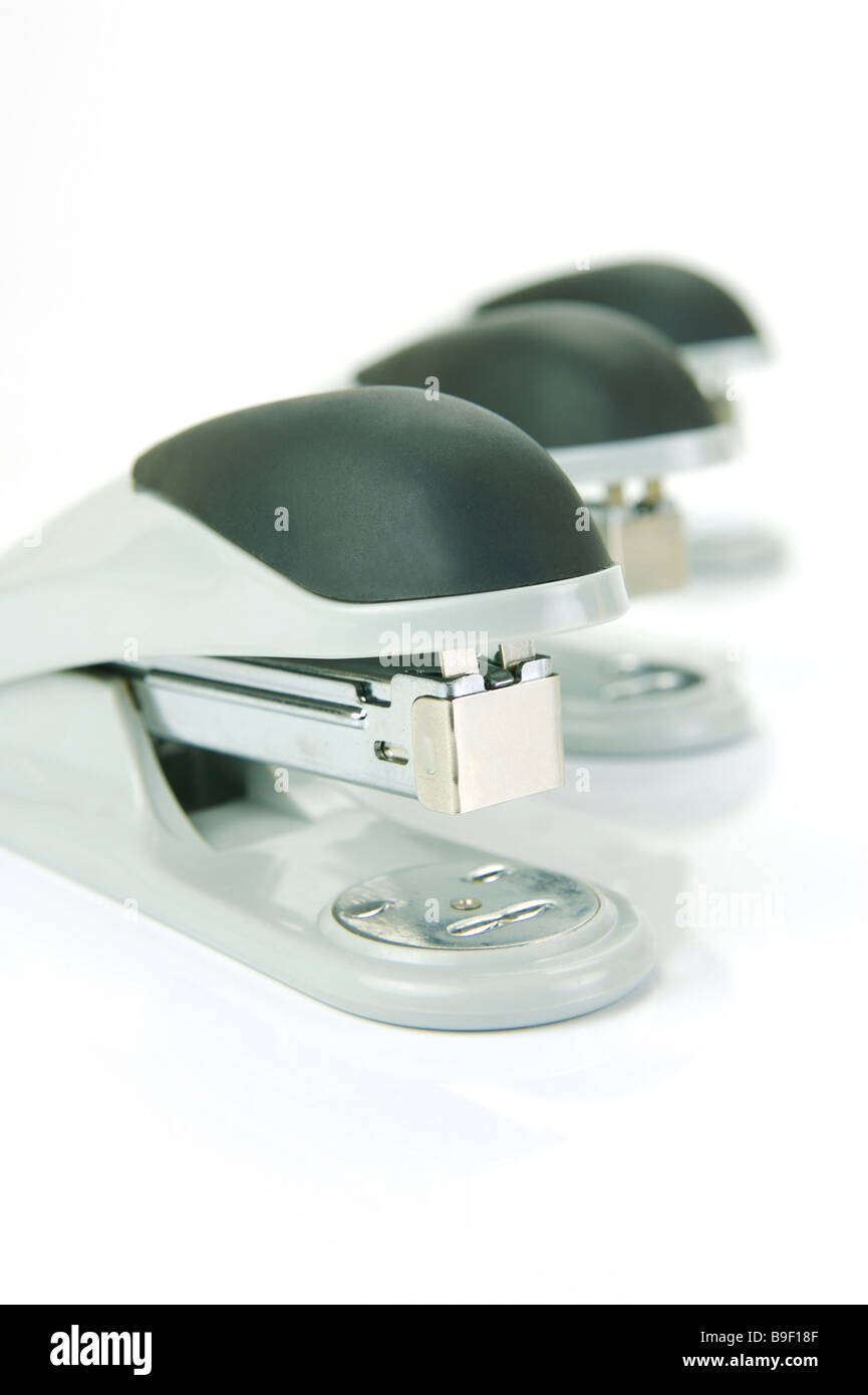 Staplers isolated against a white background Stock Photo - Alamy