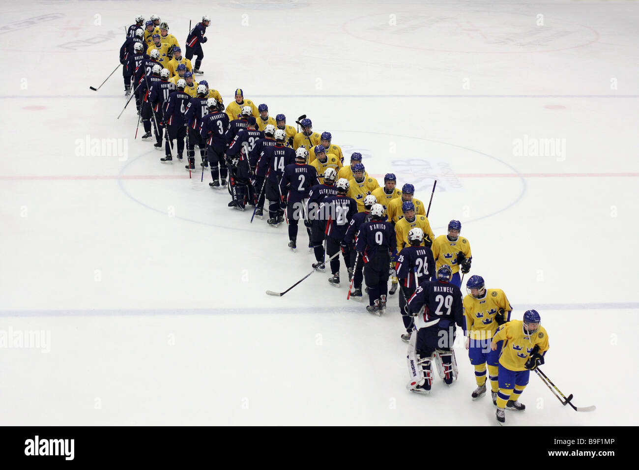 US and Swedish U18 ice-hockey teams shaking hands after the game that ended with a 3-2 US victory. Stock Photo