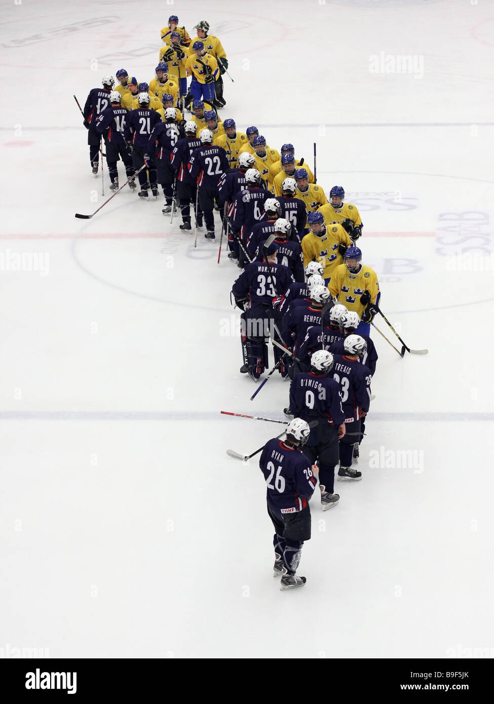 US and Swedish U18 ice-hockey teams shaking hands after the game that ended with a 3-2 US victory. Stock Photo