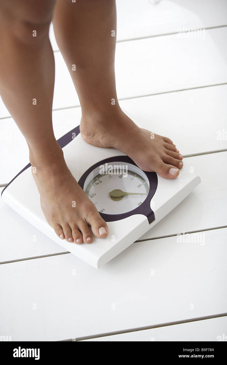 Person-scales women-legs detail series people woman legs barefoot scales stands weighs weight weight-control weight control Stock Photo