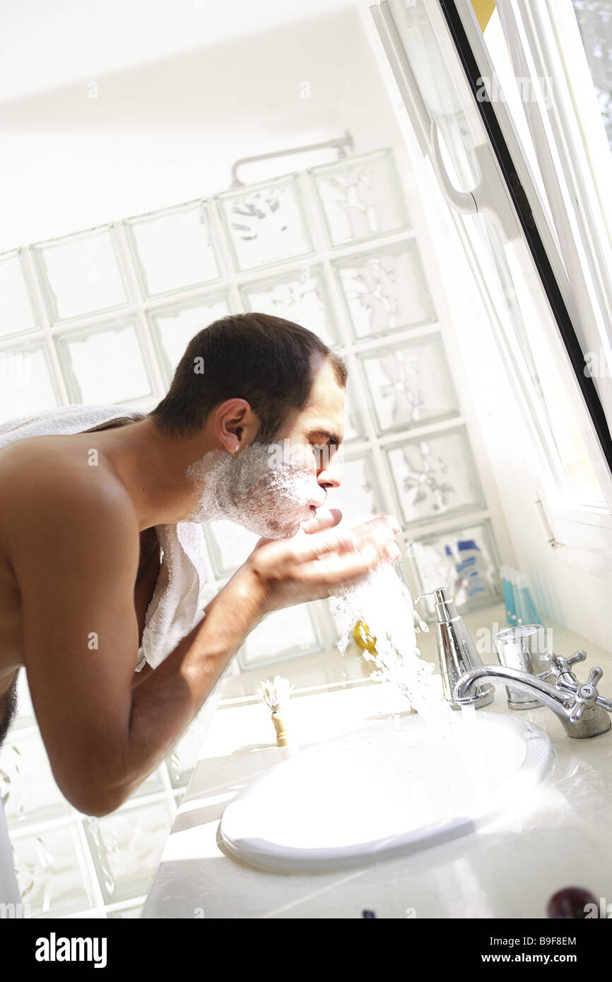 Man wetshave at the side detail series people towel face shaving cream