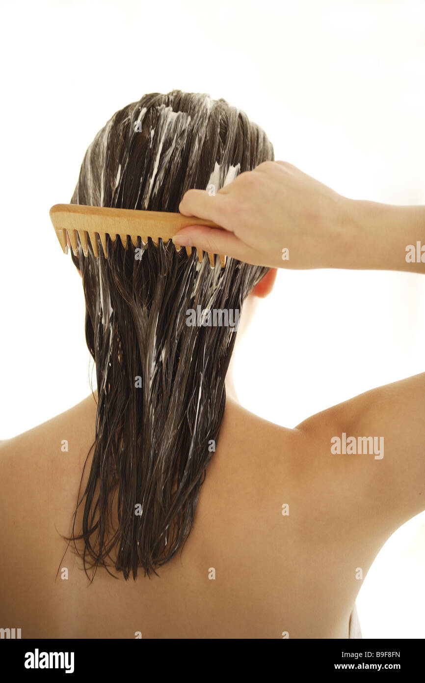 Woman hair care cure is too bulky strand-comb back view detail series people young hair wet cure-packet care-product residence Stock Photo