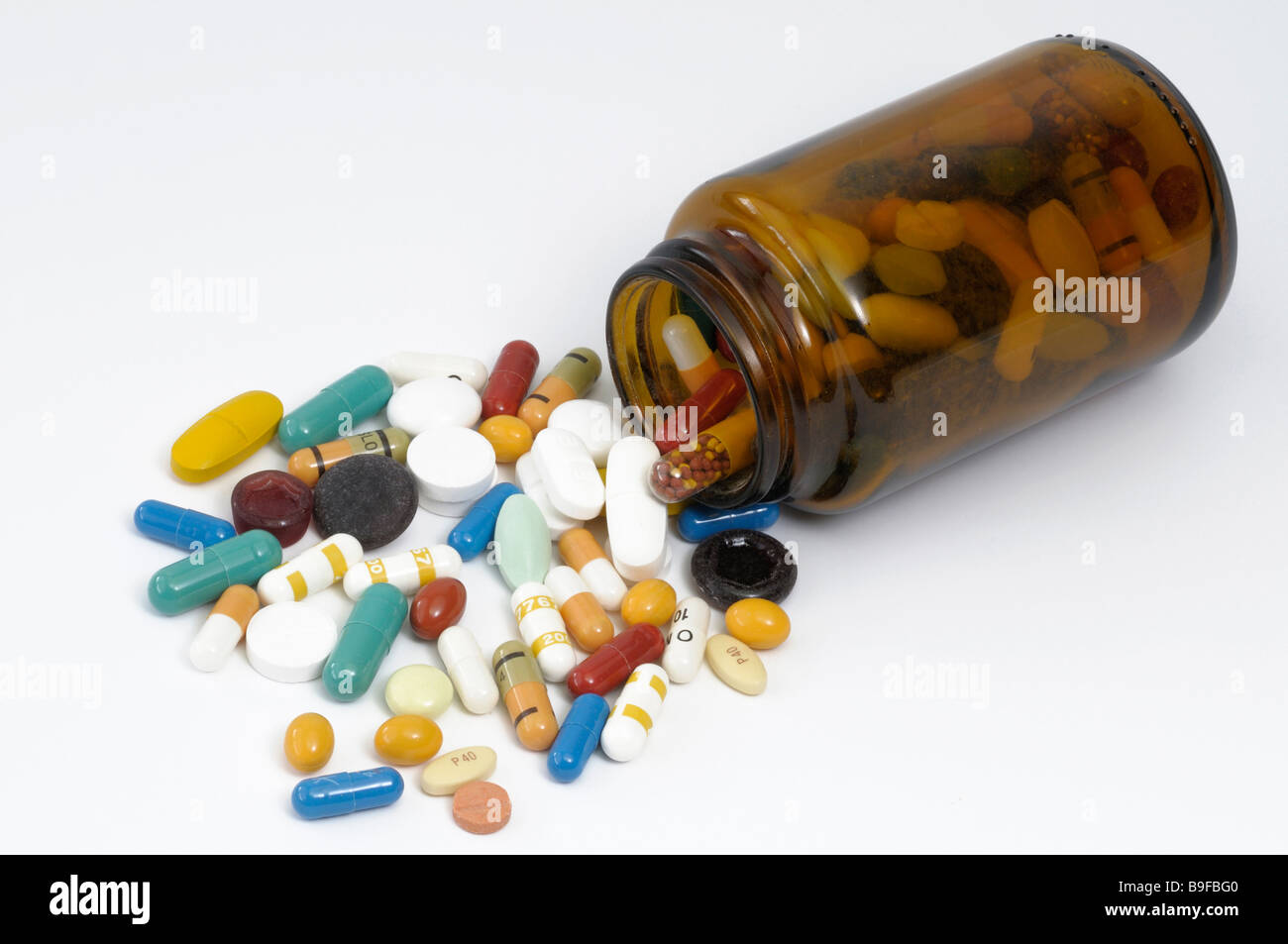 Colorful tablets with a small bottle studio picture Stock Photo