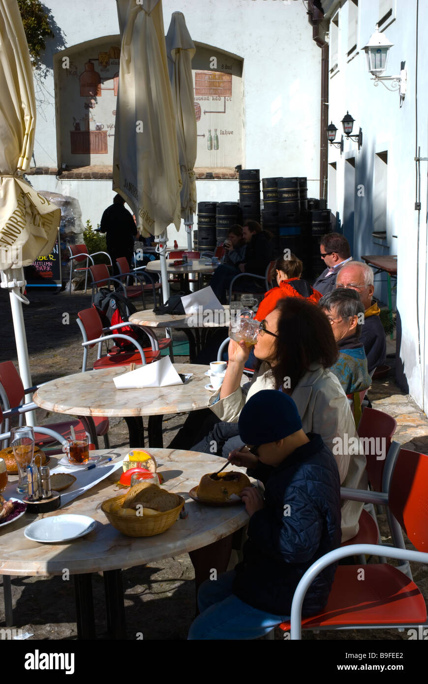 Family eating and drinking at St Herbert restaurant and brewery at