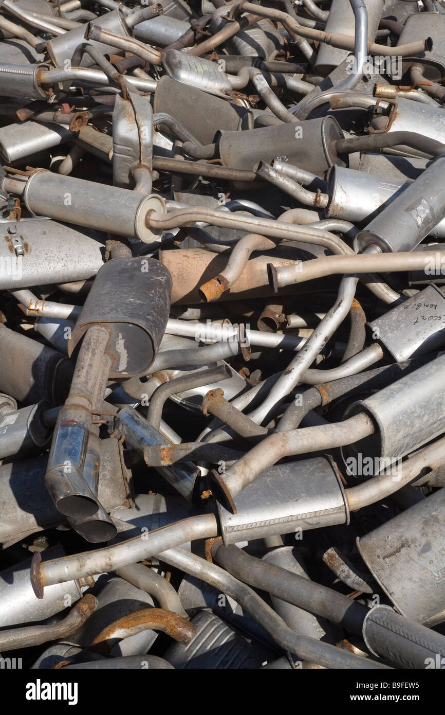 Old exhaust pipes on a scrap yard Stock Photo