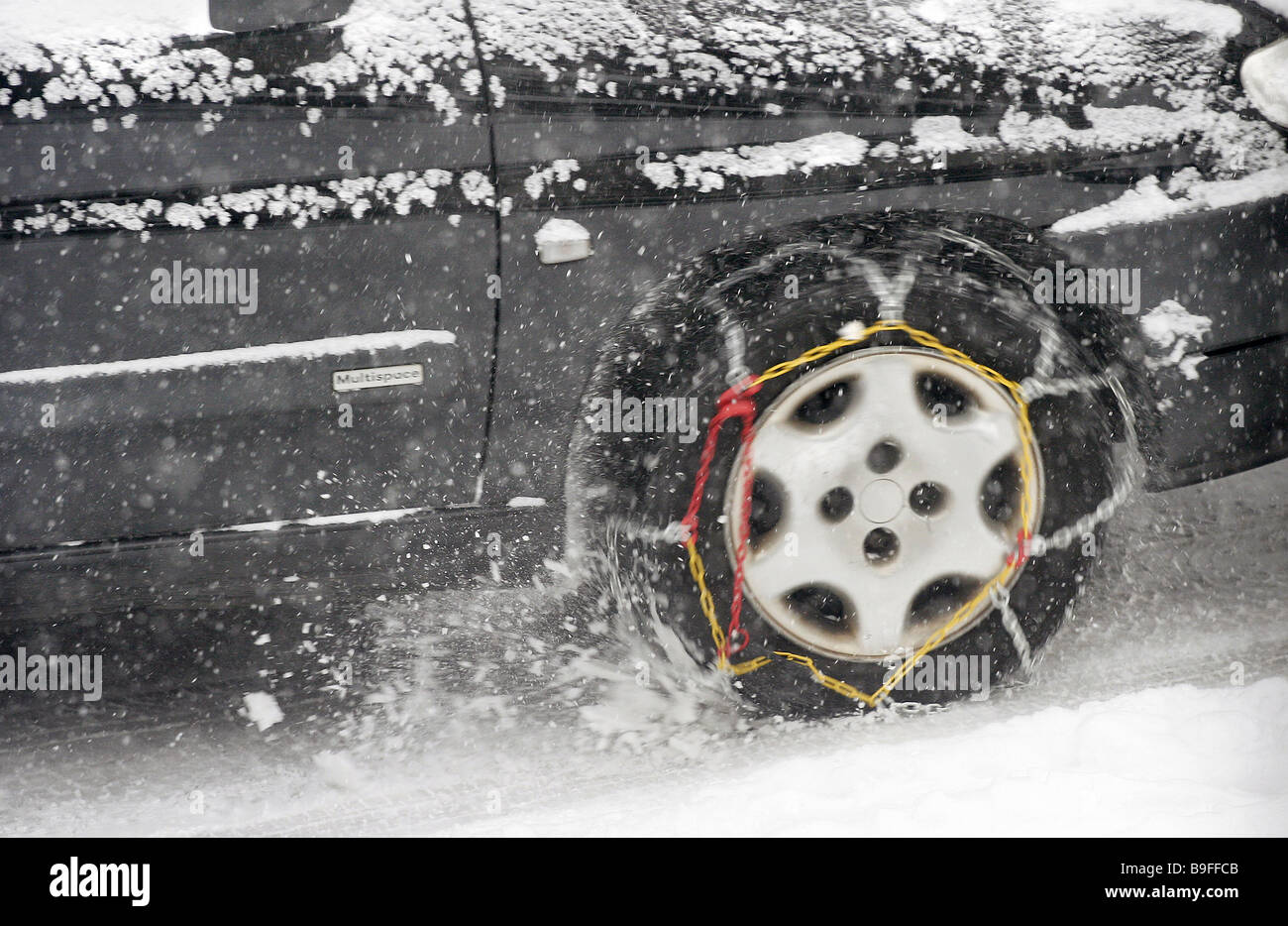 Car with snow chains Stock Photo Alamy