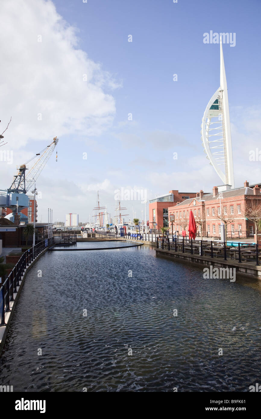 A view of the Old Dry Dock Gunwharf Quay Portsmouth with the Spinnaker Tower in the background Stock Photo