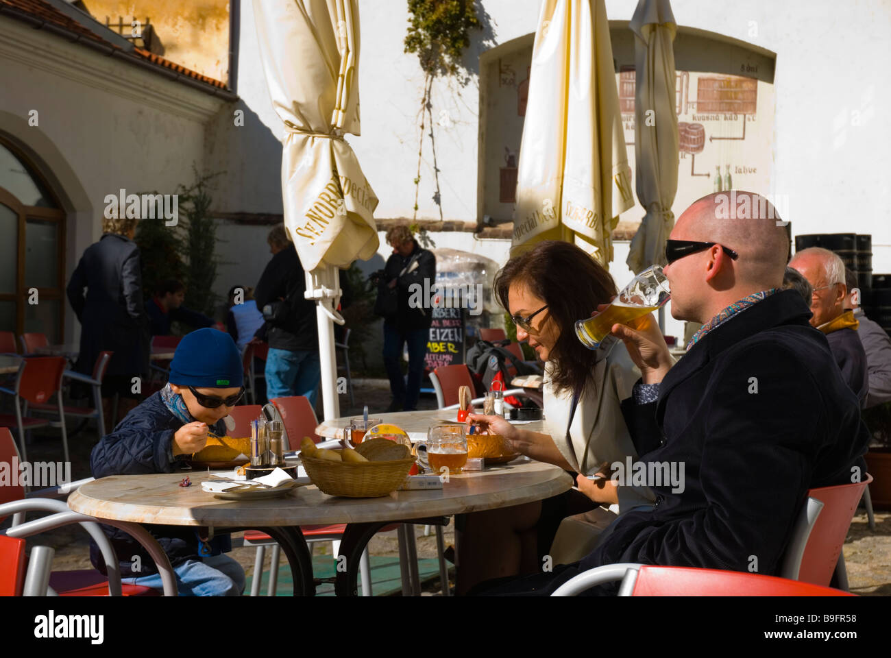 Family eating and drinking at St Herbert restaurant and brewery at