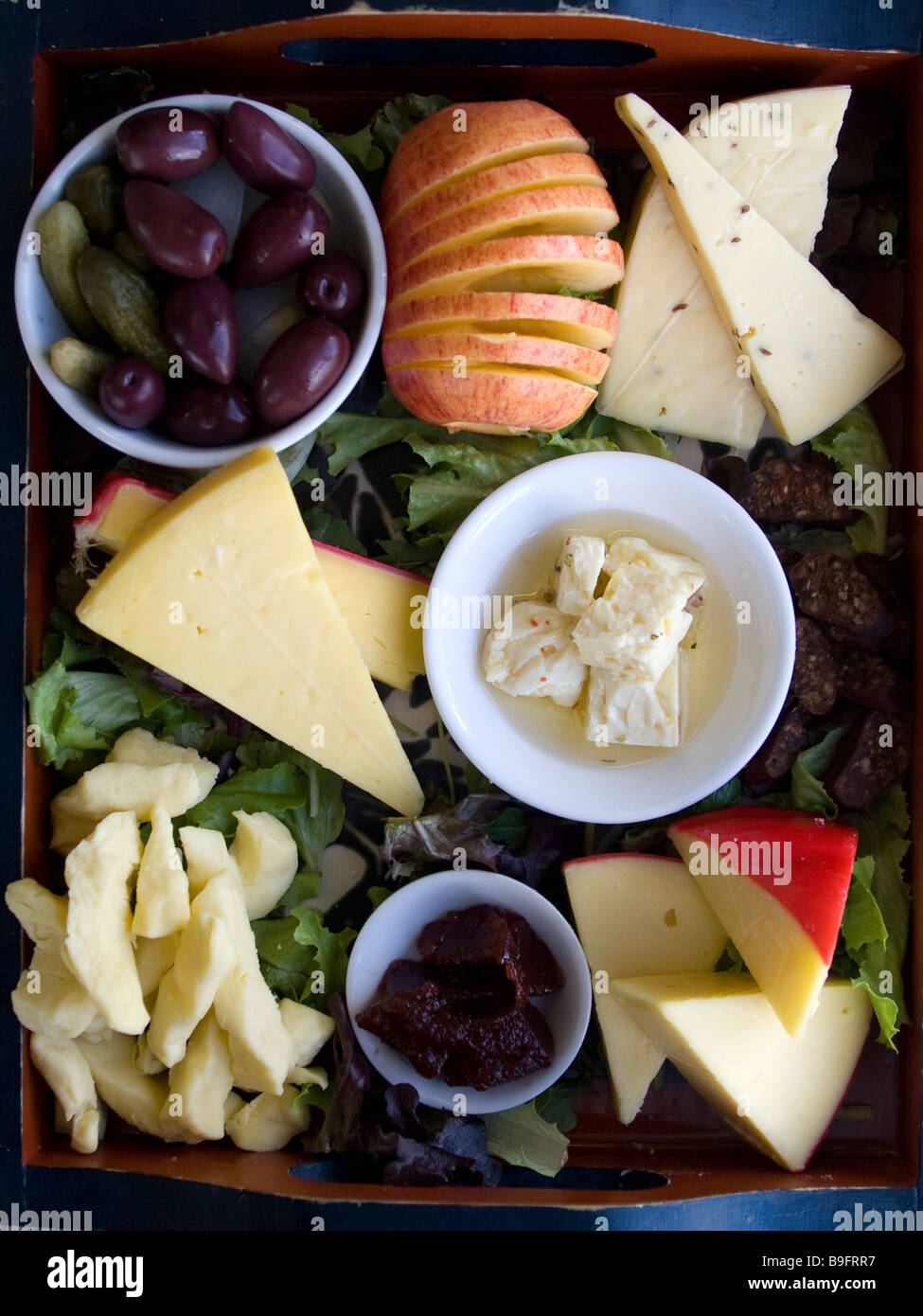 A cheese platter with different cheeses and fruit Stock Photo Alamy