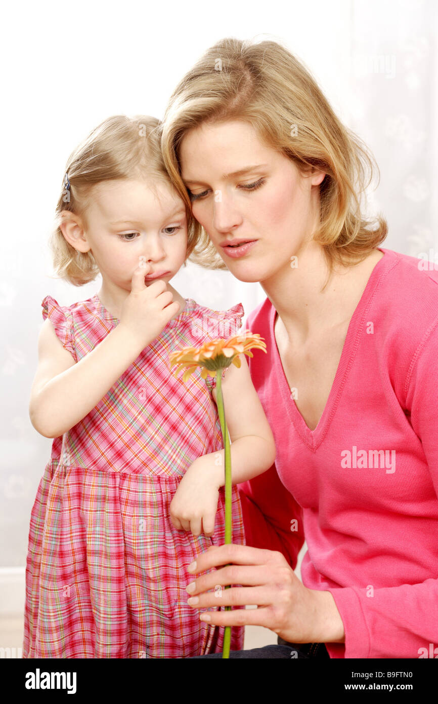 Mother daughter flower giving semiportrait people woman child girl