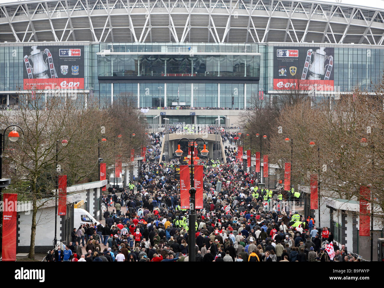 Crowds make their way along Olympic Way to Wembley Stadium London Stock