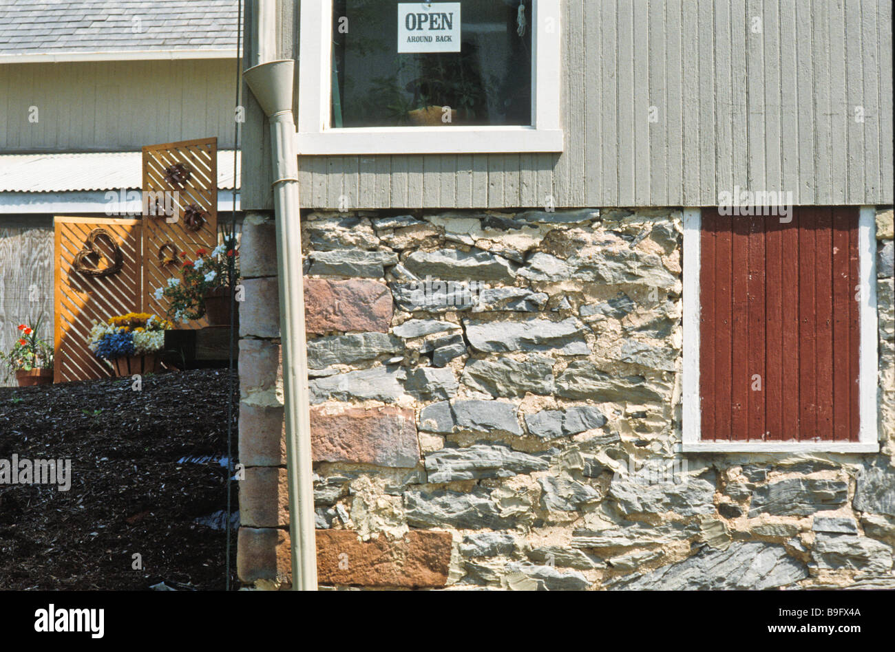 open sign in window of Lancaster PA antique crafts tourist store Stock