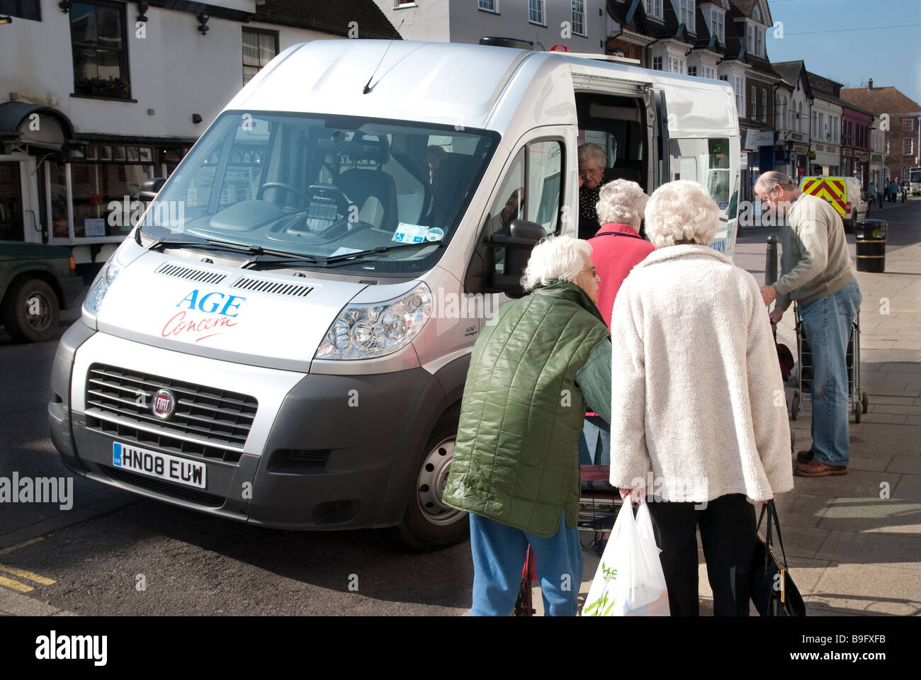 OAP's boarding Age Concern mini bus Stock Photo