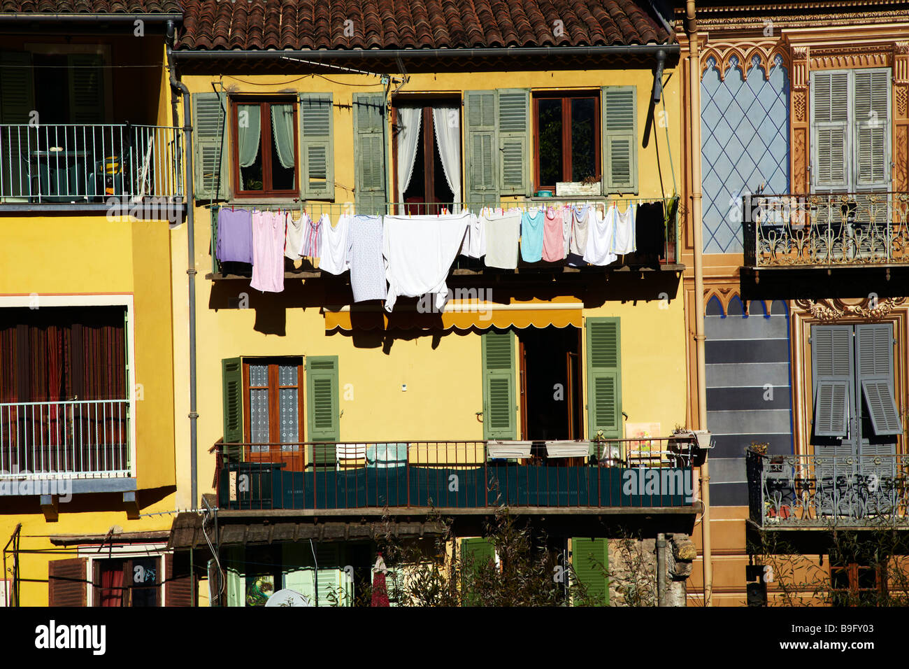 yellow house with laundry, Sospel, France Stock Photo
