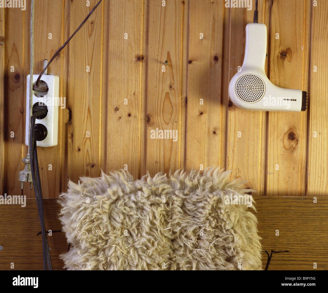 Wall socket hair dryer fur Stock Photo Alamy