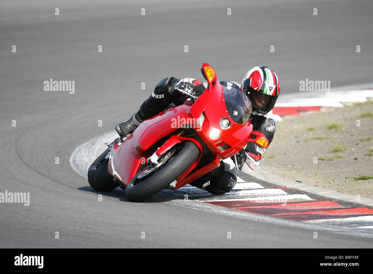 Racetrack motorcyclists curve-situation street curve people motorcycle motor-biking traffic drives hobby leisure time speed fun Stock Photo