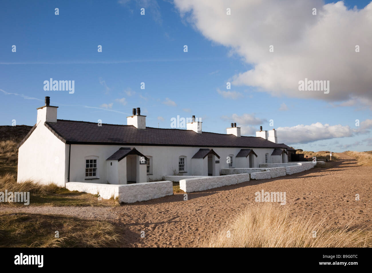 Old Pilot s cottages on Llanddwyn Island National Nature Reserve in the AONB. Newborough Anglesey North Wales UK Britain Stock Photo