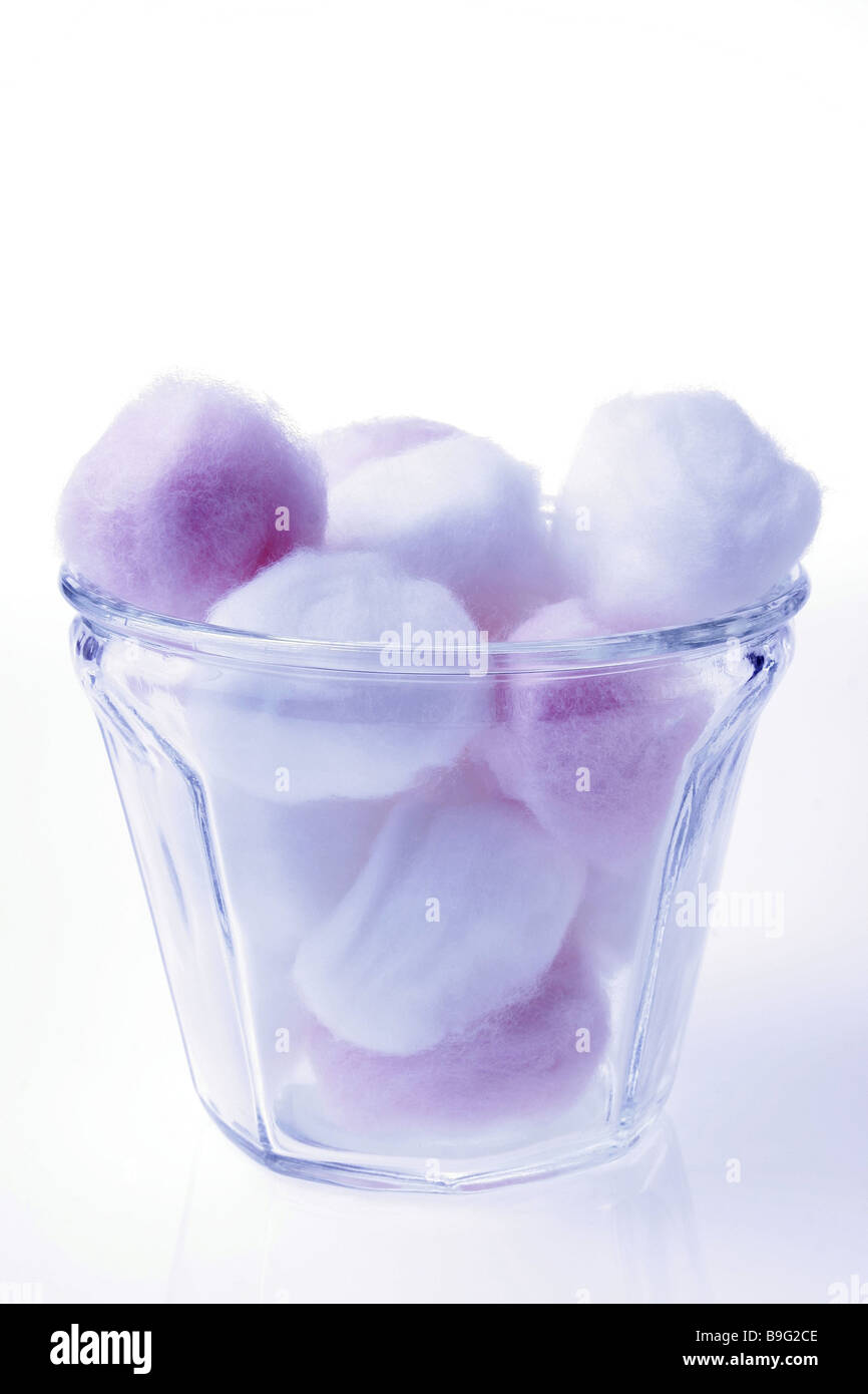 Periwinkle filled with colored cotton balls spilled Stock Photo by ©dbtale  8666744