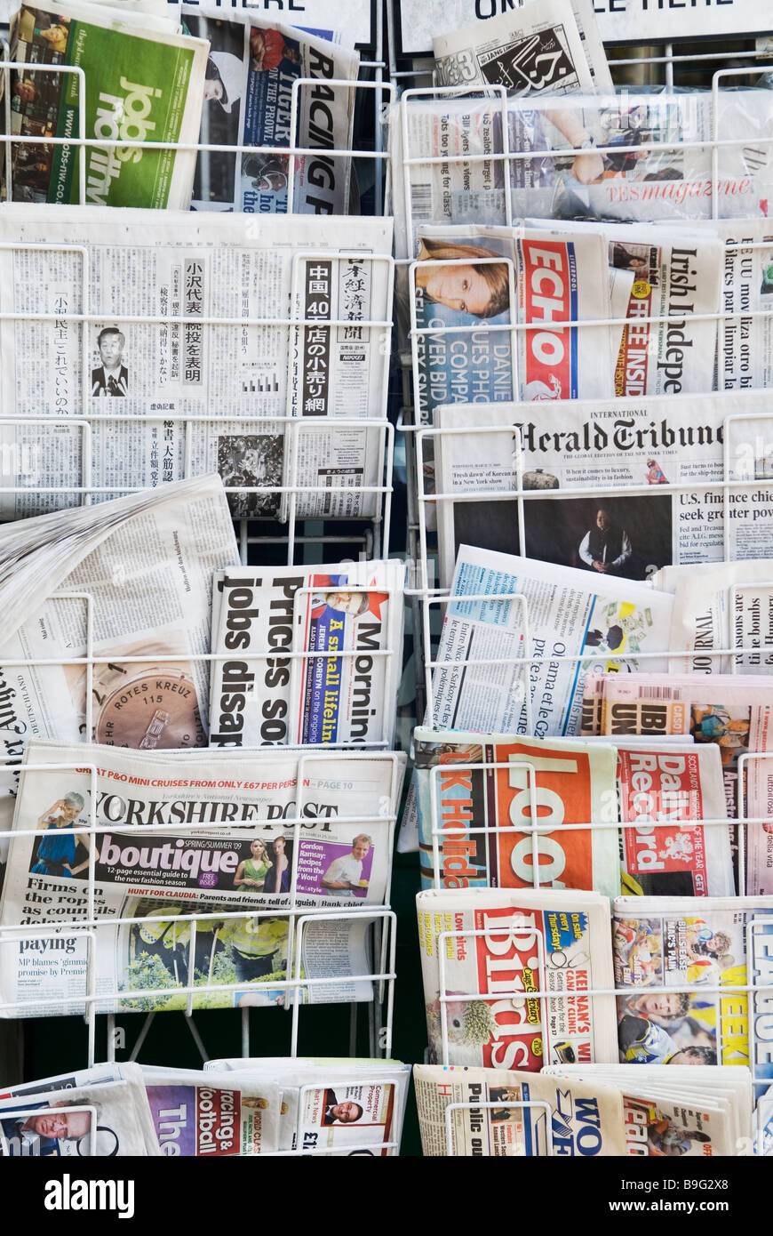 Newspapers in a newsstand Manchester city centre UK Stock Photo