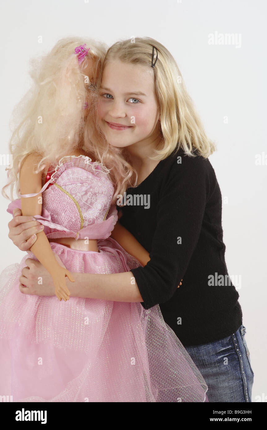 girl blond Barbie embraces cheerfully detail series people child toy doll  Barbie-doll giant-Barbie carry holding activity Stock Photo - Alamy