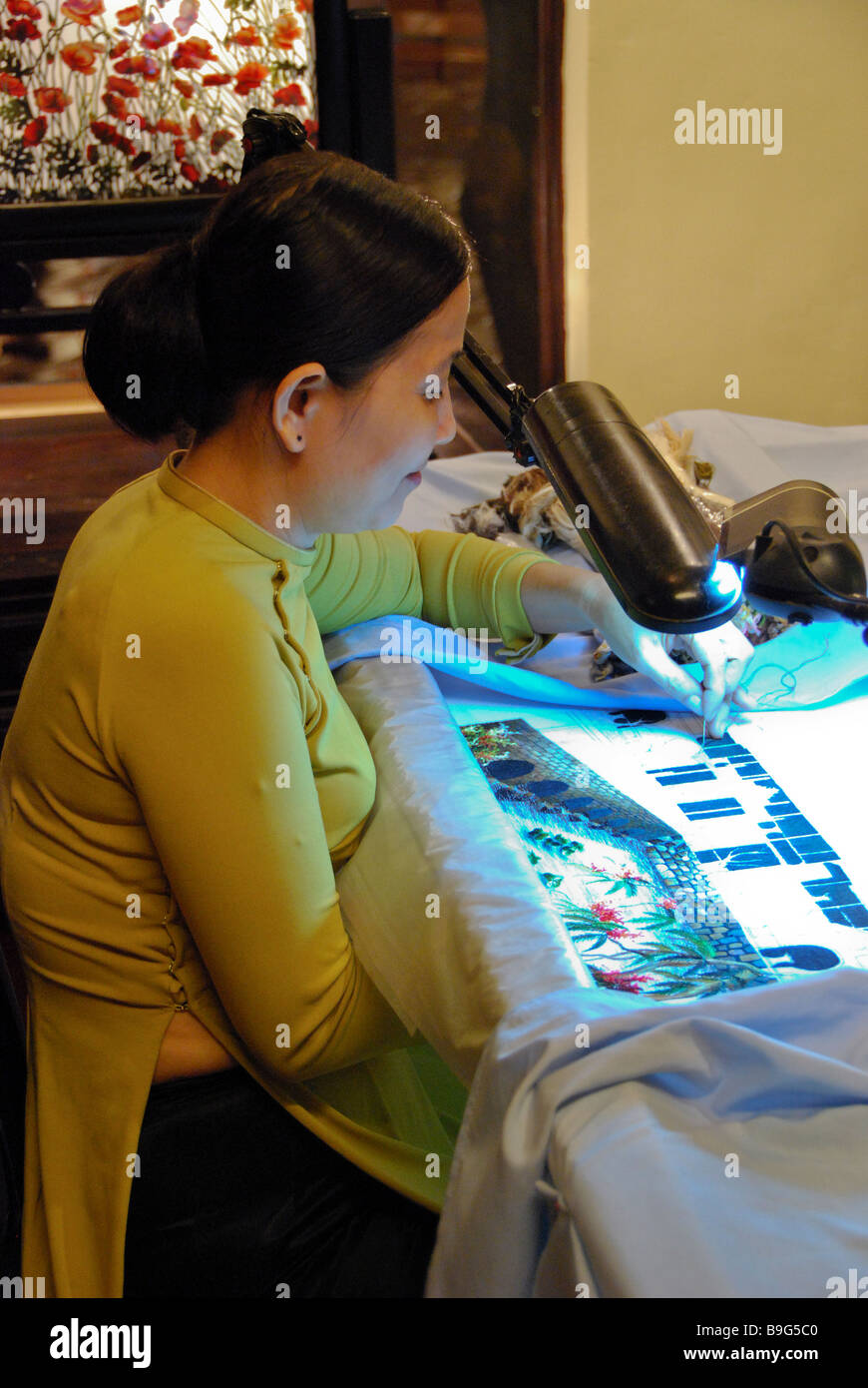 Producing silk embroidery, Nah Trang, Vietnam Stock Photo