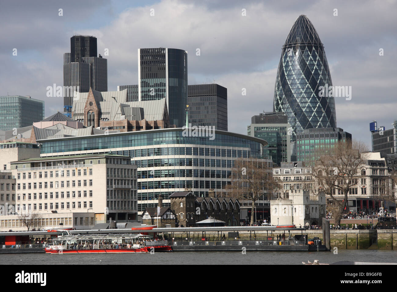 london england uk leisure boat transport sightseeing river thames gherkin natwest tower Stock Photo