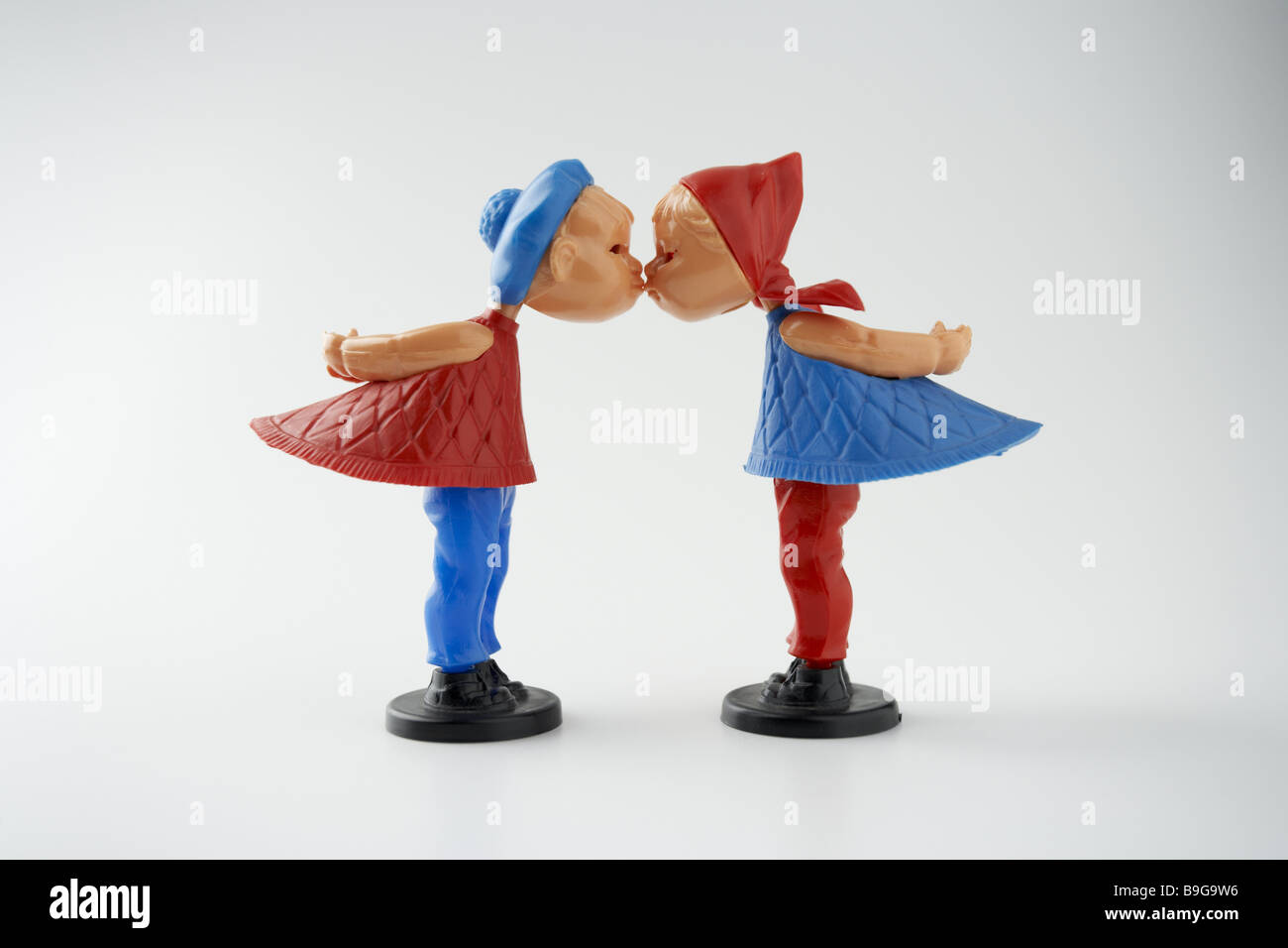 Attraction attraction relationship figures harmony boy children concept plastic kiss kiss-dolls kisses love caress magnetically Stock Photo