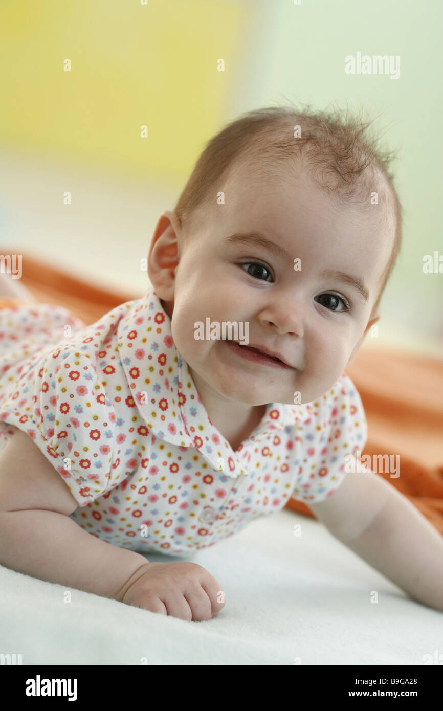 Baby lying prone position smiling arm portrait rest 6 months arm baby