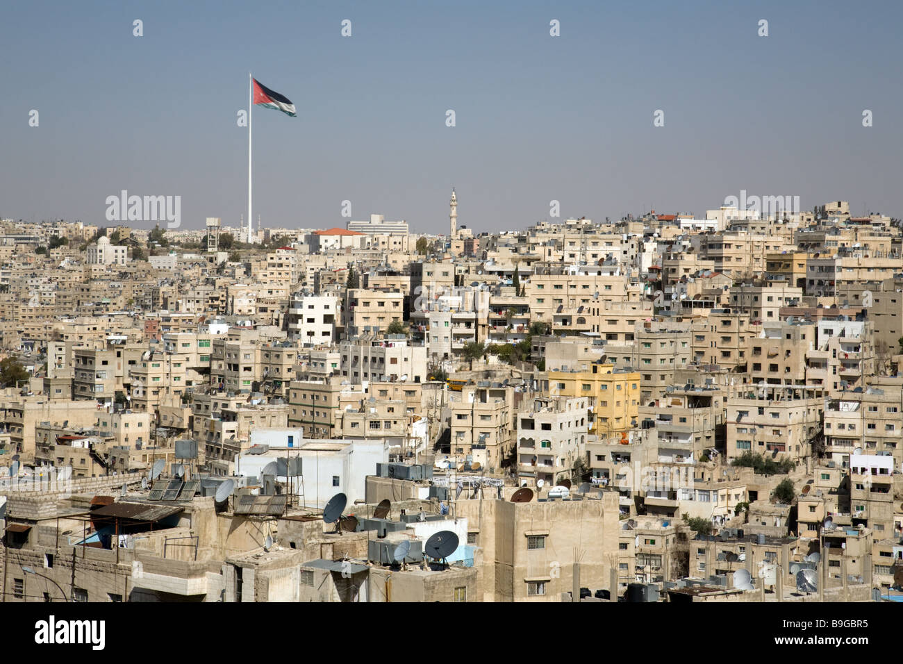 The city of Amman with the Jordanian flag flying; Jordan Stock Photo