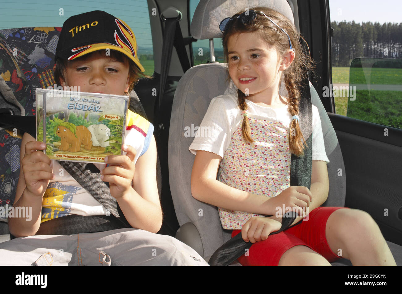 girl boy car back seat Stock Photo Alamy