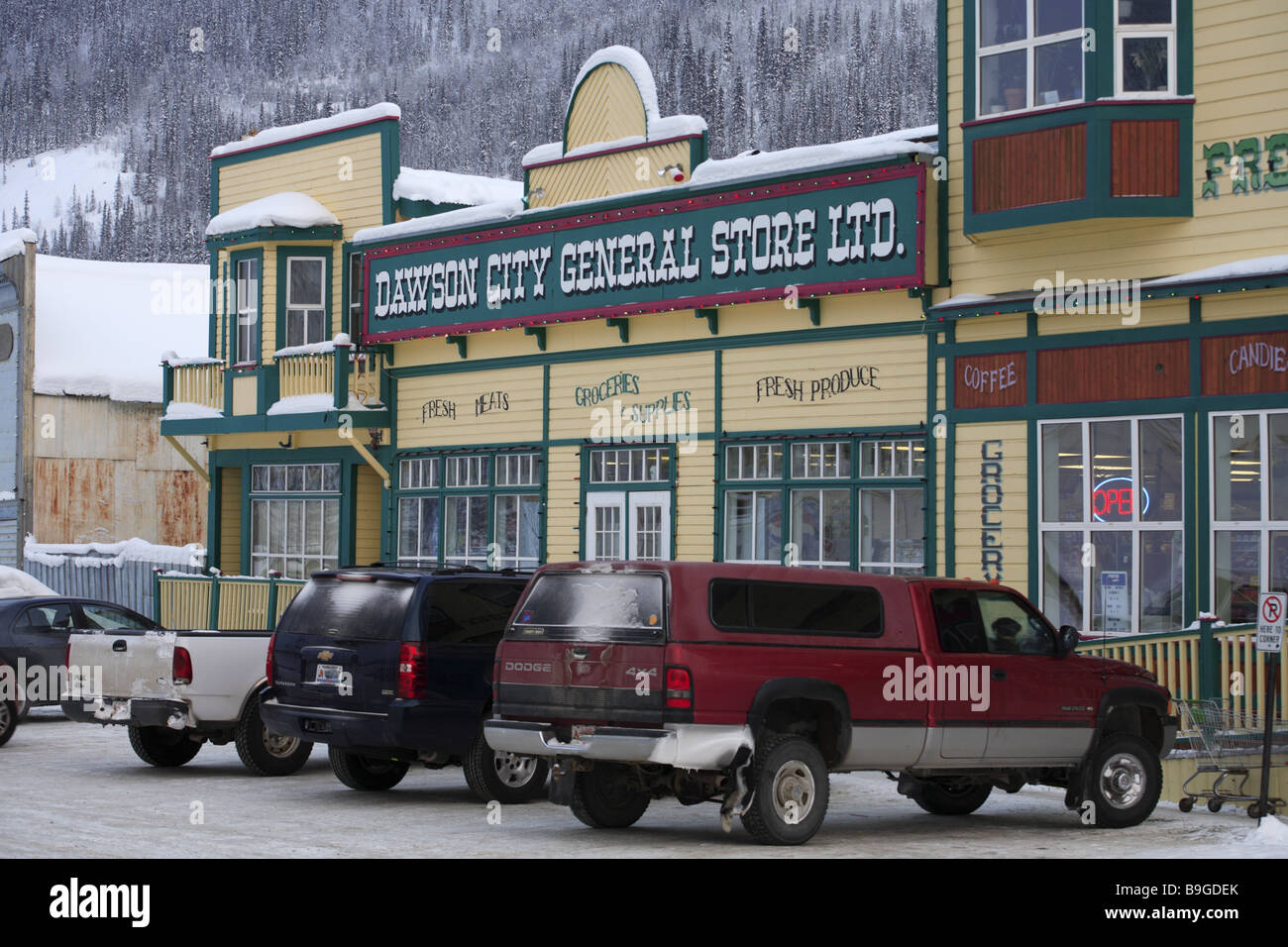 Canada Alaska Yukon Territory Dawson city row of houses cars winter