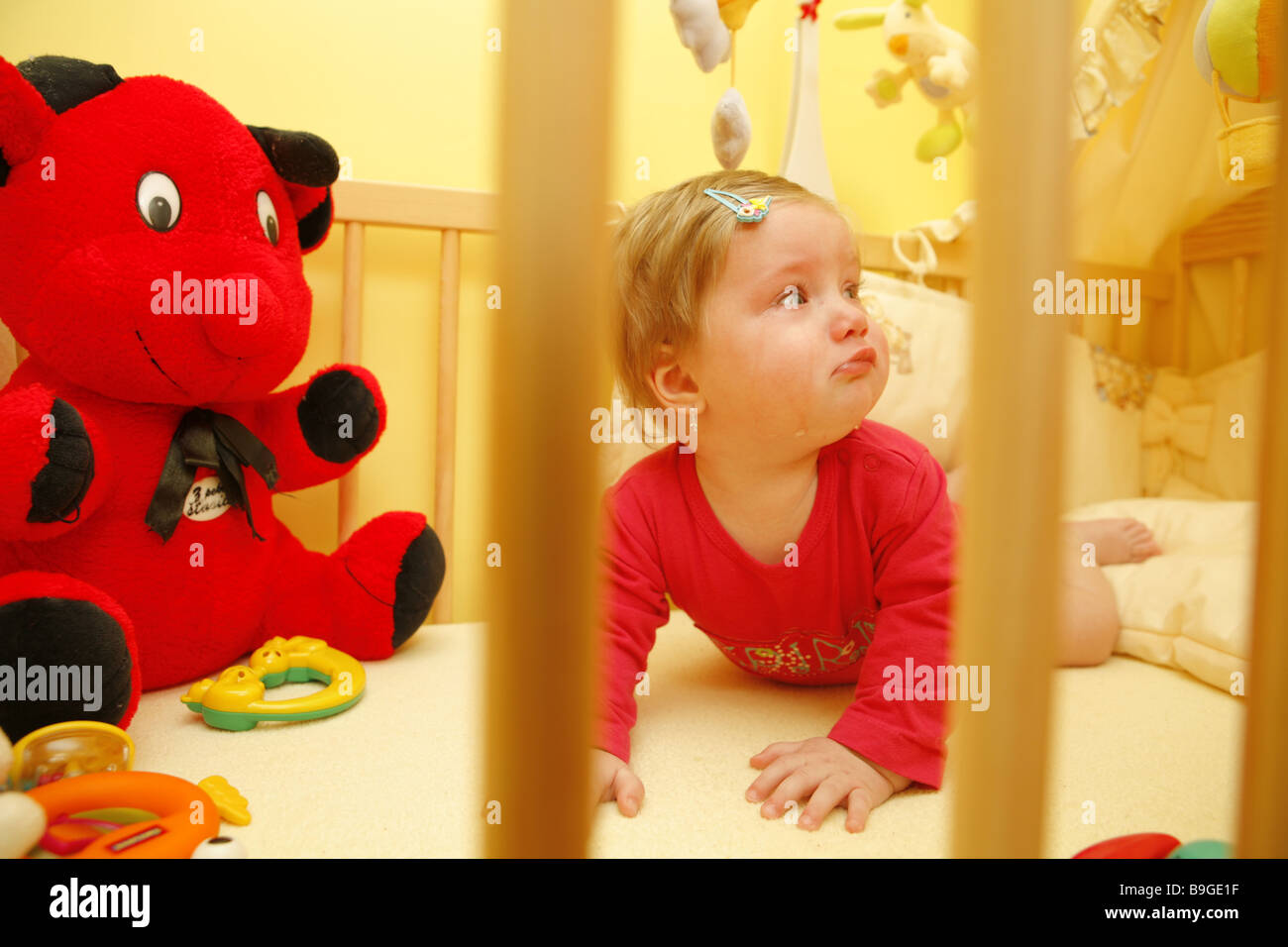 Little baby in a child bed Stock Photo