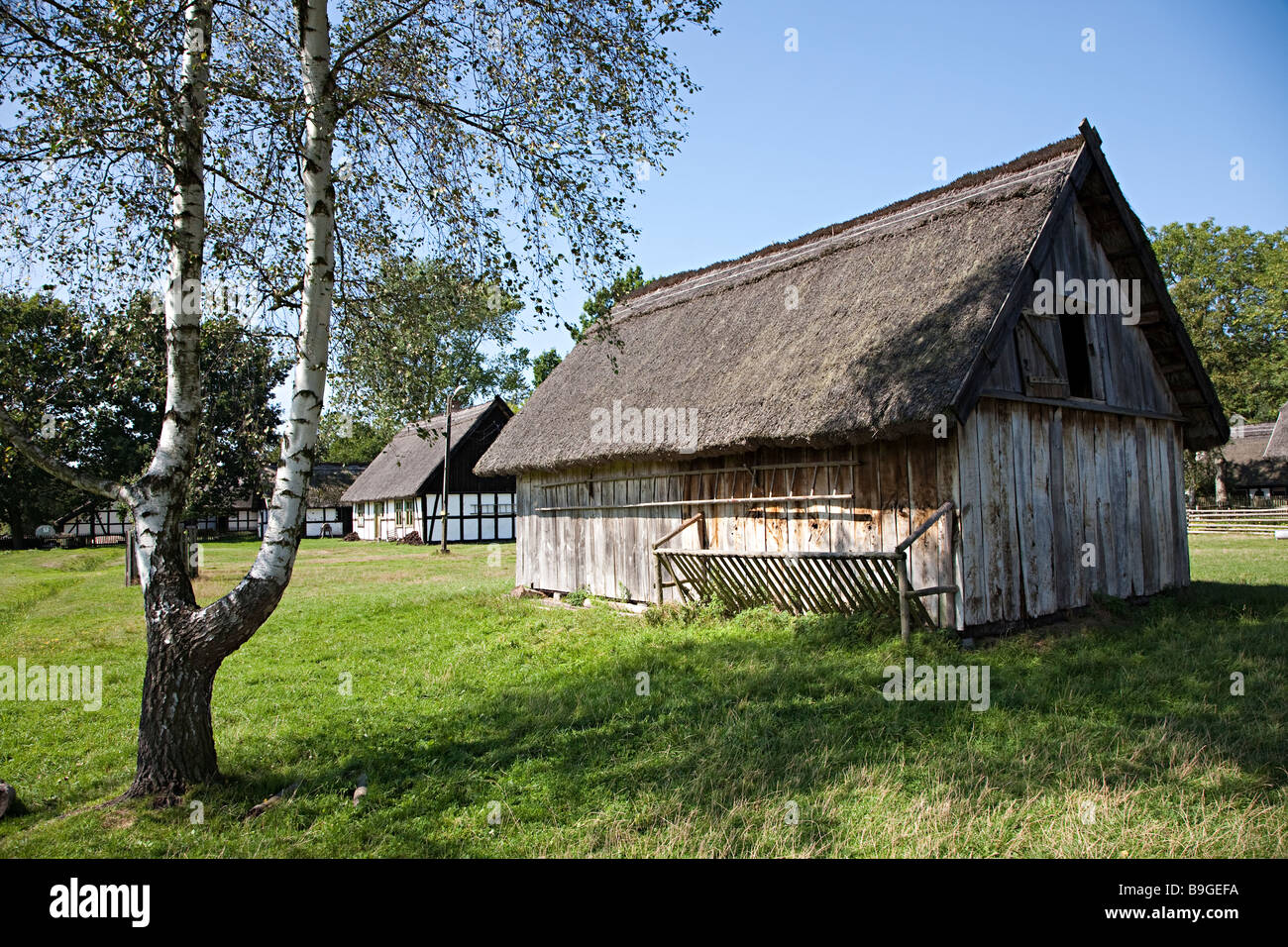 Thatched farmyard barn at Kluki folk museum Poland Stock Photo