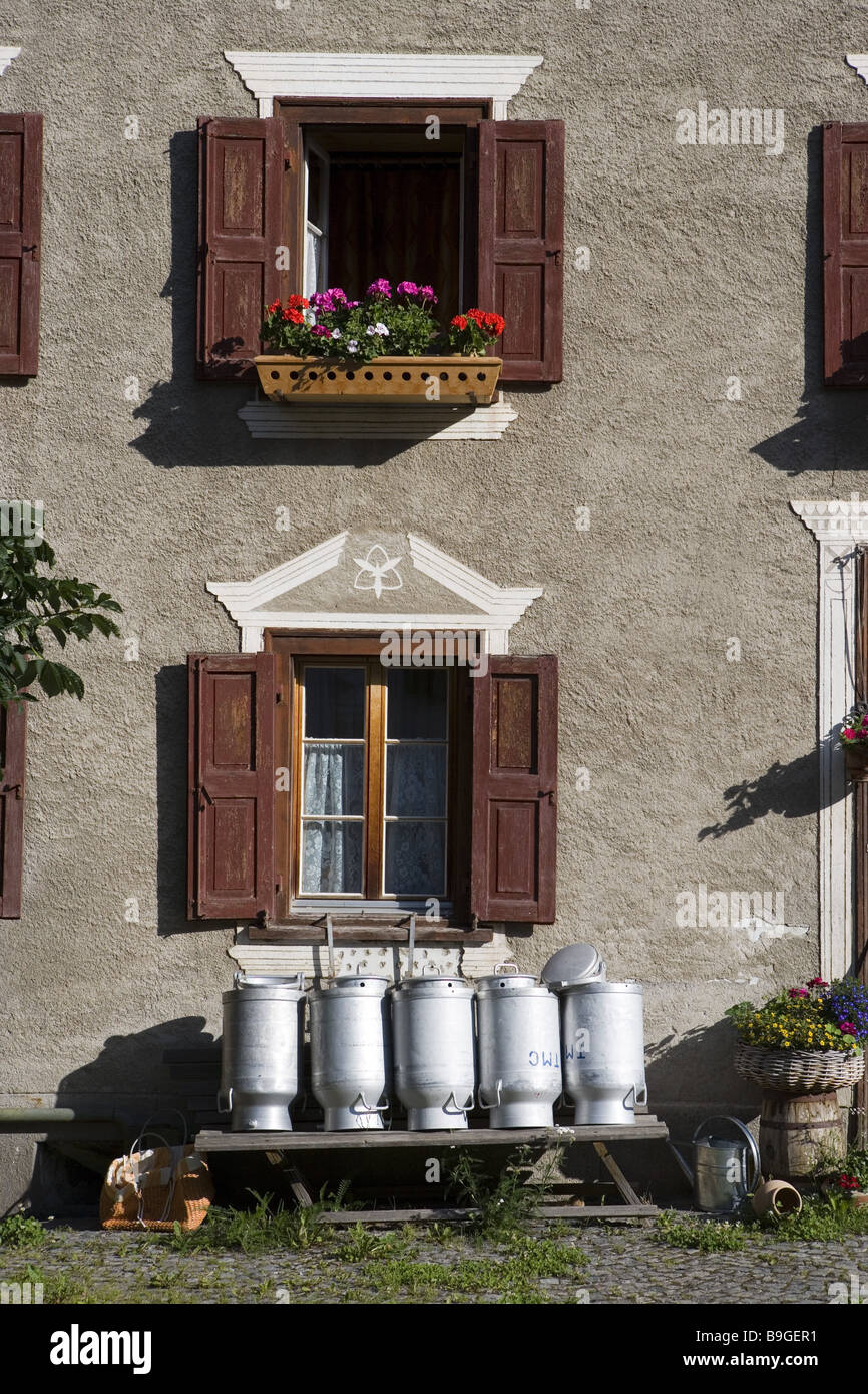 Switzerland Graubünden Bergün residence milk cans Stock Photo