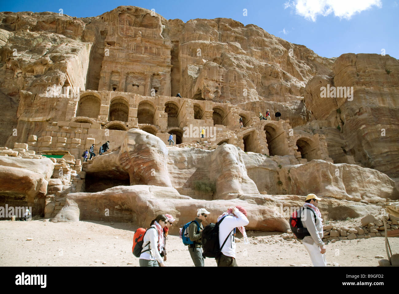 Tourists in front of the Urn tomb, Petra Jordan Stock Photo