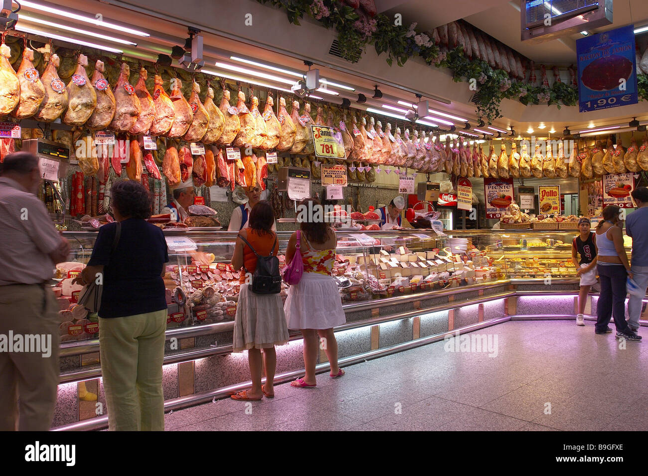 Spain Madrid grocery store indoors meatbar customers Stock Photo Alamy