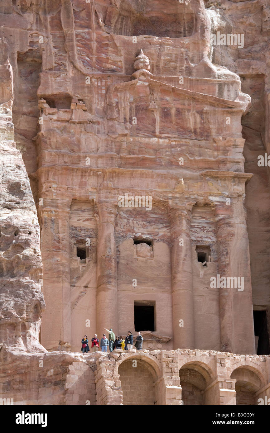 Tourists in front of the Urn tomb, Petra Jordan Stock Photo