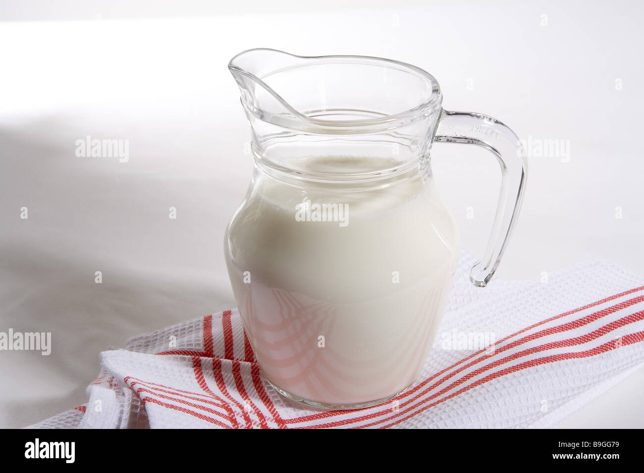 Milk-jug food still life fact-reception milk jug glass-jug newly nutrition beverage healthy Calcium calciumhaltig cloth Stock Photo