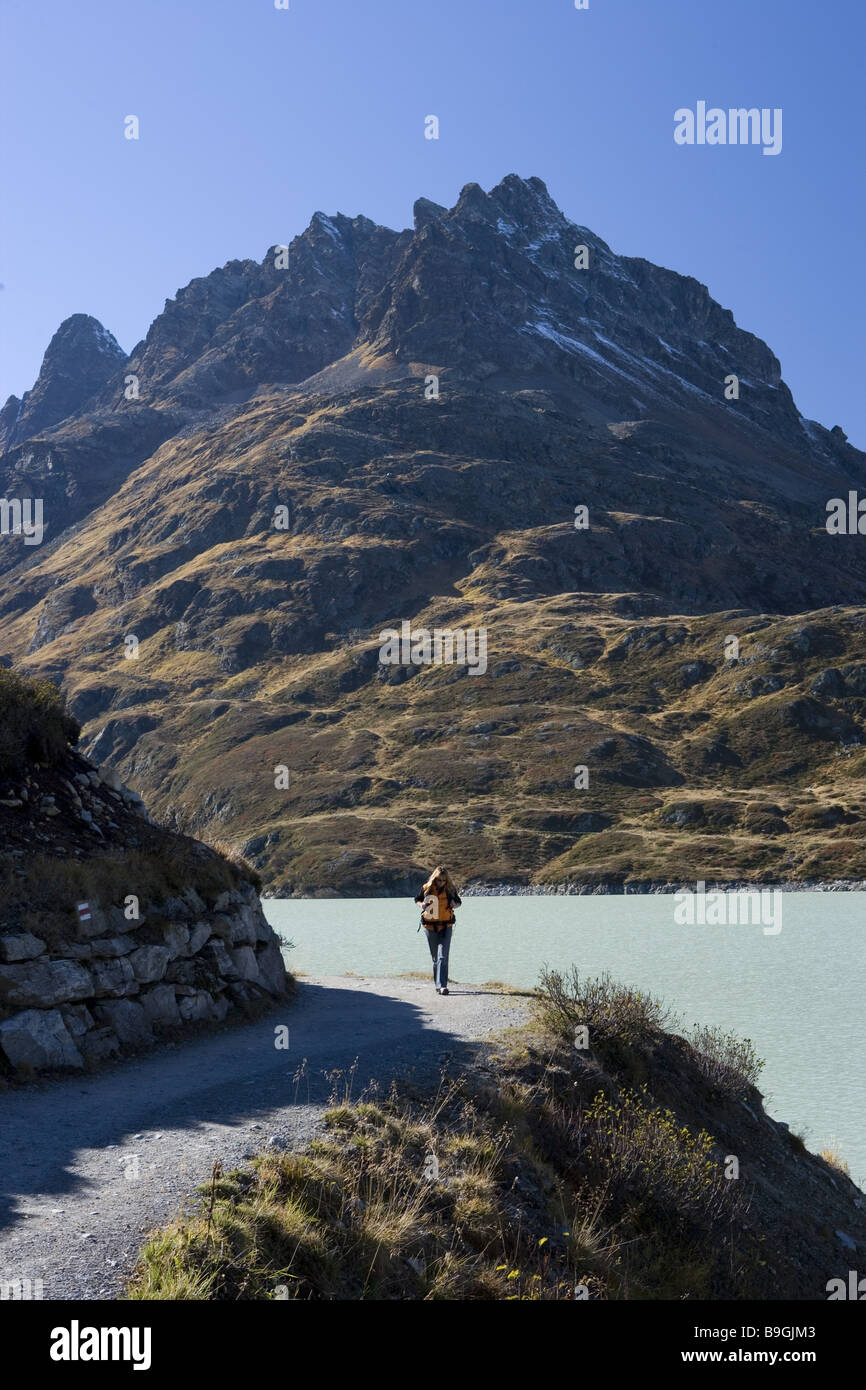 Austria Vorarlberg Montafon Silvretta reservoir way hikers  Activity alone Alps outsides mountain scenery mountaineering Stock Photo