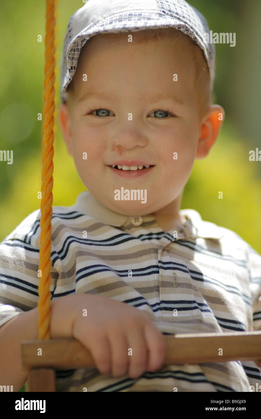 Little boy on a swing Stock Photo