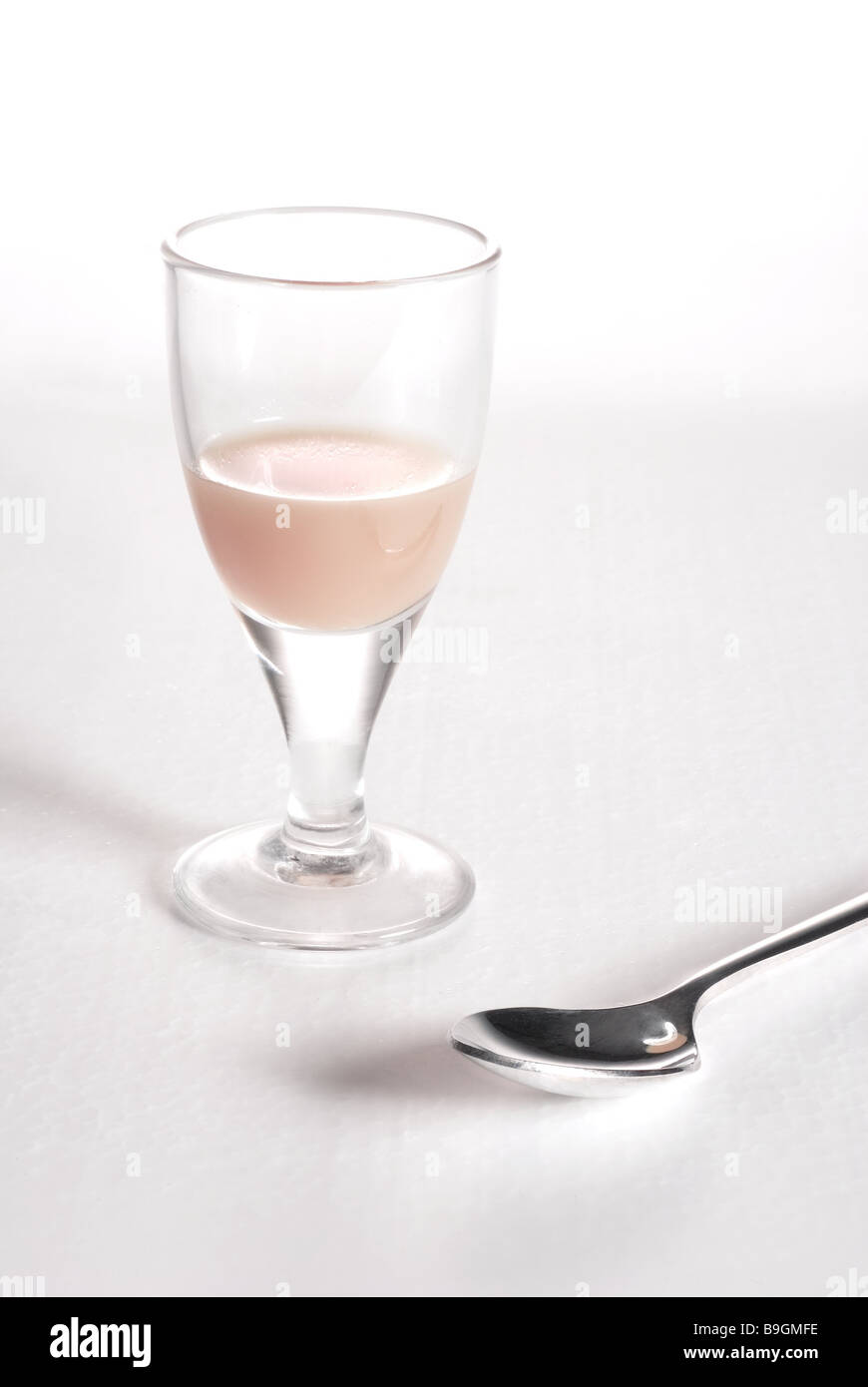 glass cough-juice spoon liqueur-glass medicine medicine syrup medication liquid juice teaspoon dosage illness cough health Stock Photo