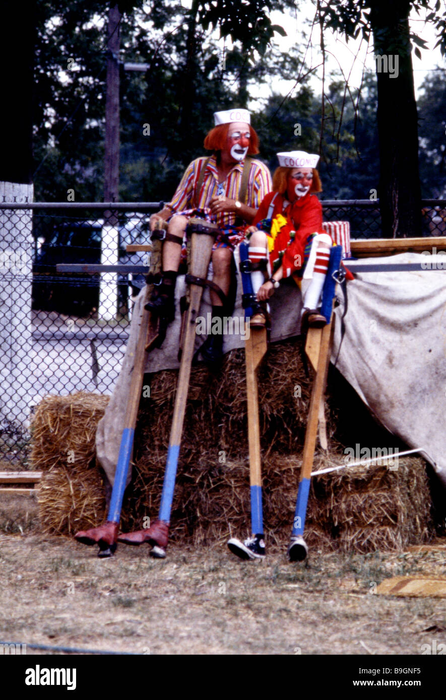 Clown stilt walkers preparing Stock Photo Alamy