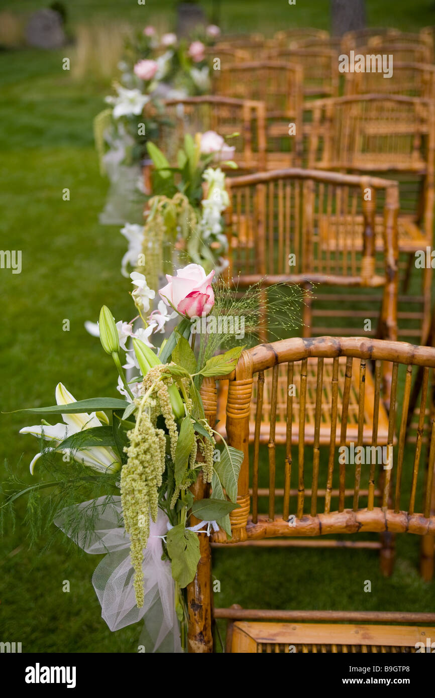 Rows Of Chairs At A Country Wedding Decorated With Pink And Green