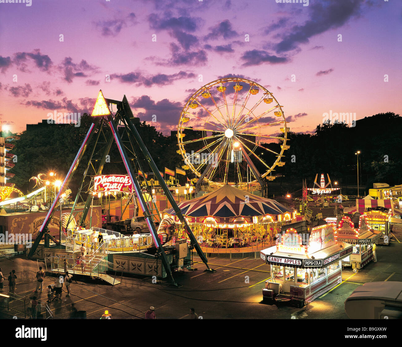 usa New York city Bronx festival twilight North America kermess amusement-party fairground rides Ferris wheel market-stands Stock Photo