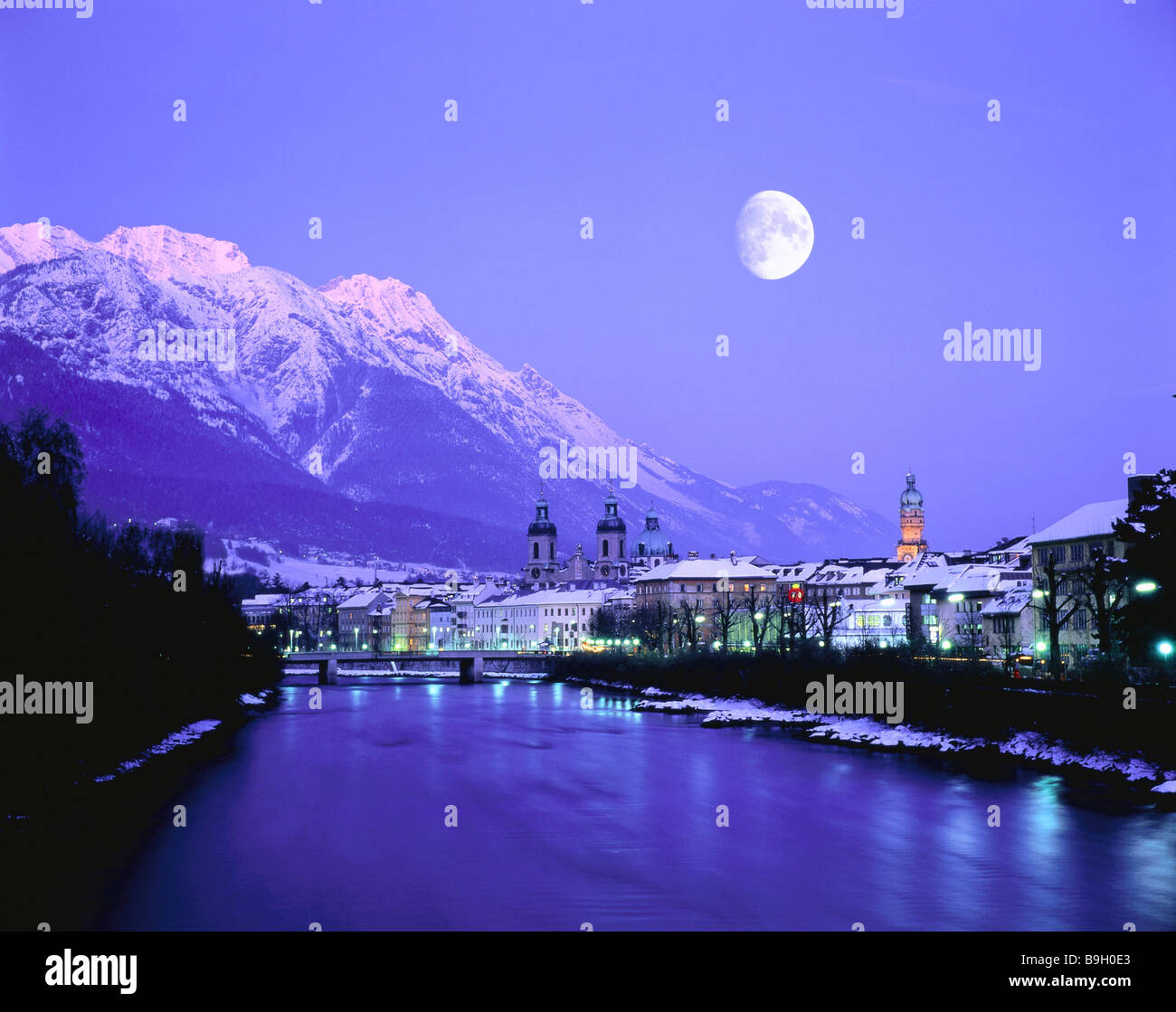 Austria  Tyrol  Innsbruck  city view  Inn  winter  evening  moon  [M]  North-Tyrol  city  river  Häuserreihe  buildings Stock Photo