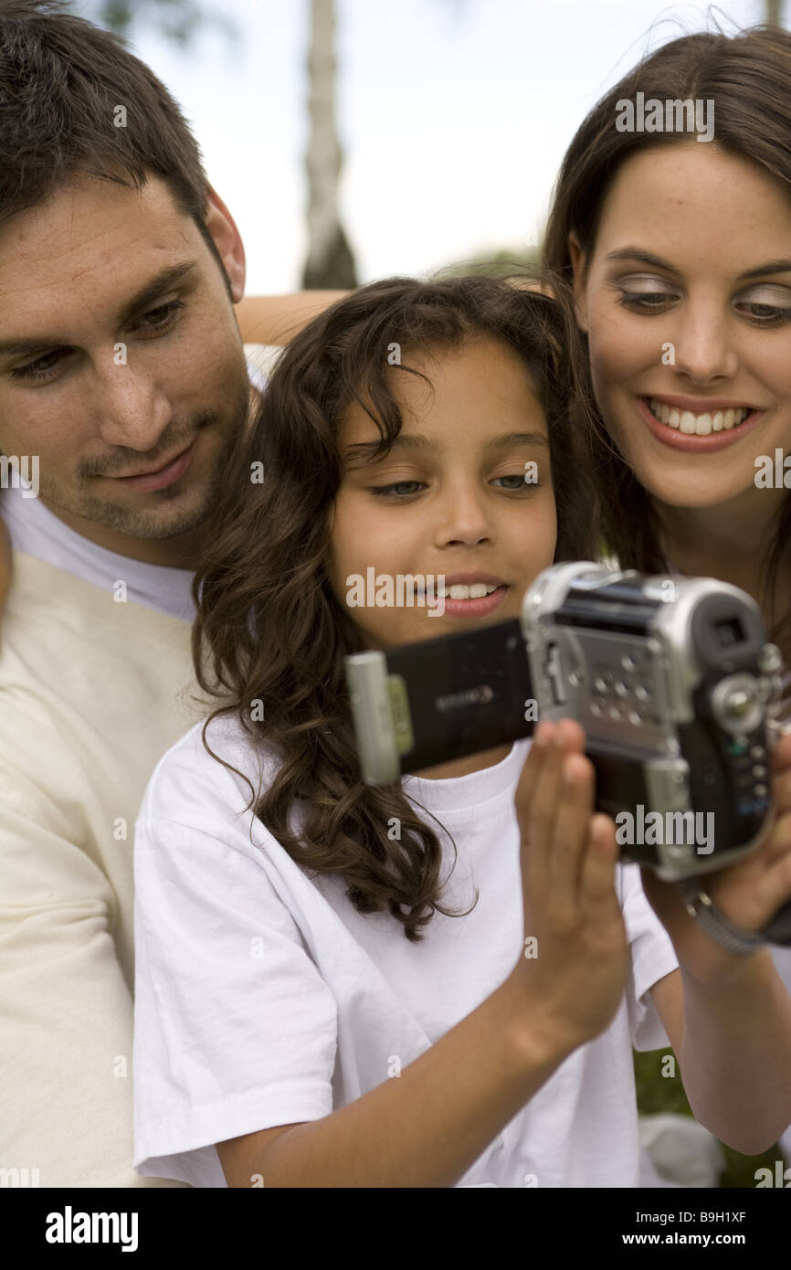 Family camcorders joy films smiling outside 1012 years 11 year 2030